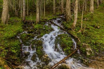 Fototapeta premium Waterfall at Crno jezero lake in Durmitor mountains, Montenegro