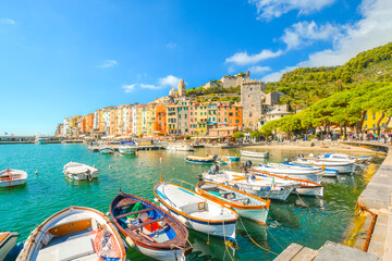 Boats line the harbor of the colorful, touristic Italian city of Portovenere, along the Ligurian Coast of the Italian Riviera.