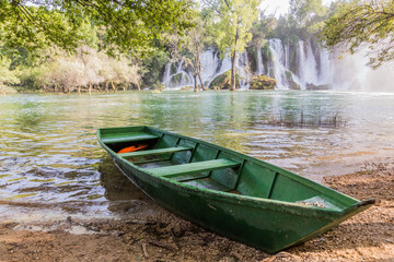 Boat at Kravica waterfalls in Bosnia and Herzegovina