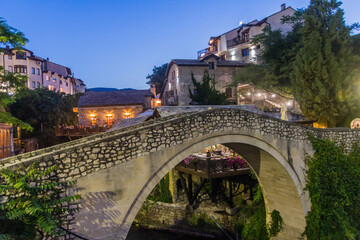 Evening view of Kriva cuprija (Crooked bridge) in Mostar. Bosnia and Herzegovina