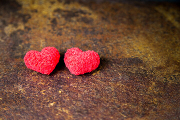 Obraz premium Two red hearts. On a rusty background. Valentine's day, love.