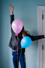 teen girl jumping with balloons