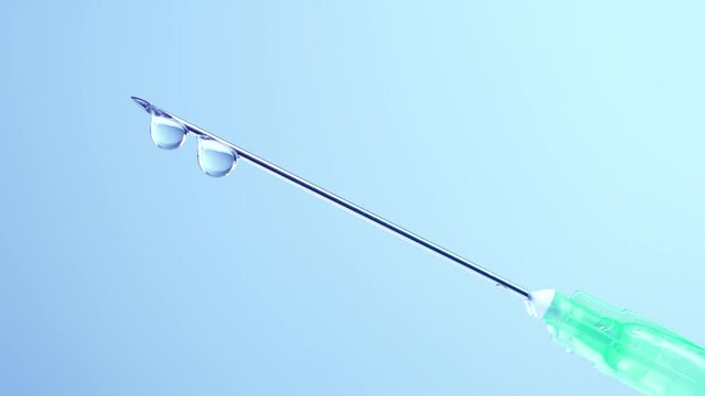 Vaccine dripping from sterile needle syringe macro close up. Administrating medication with medical needle syringe and vaccine injection for patient vaccination in medical hospital. Health concepts.