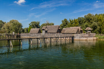 Fototapeta premium Stilt houses (Pfahlbauten), Stone and Bronze age dwellings in Unteruhldingen town, Baden-Wurttemberg state, Germany