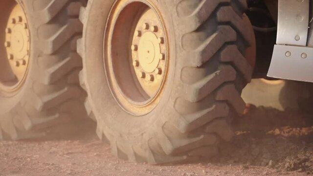 The tractor is grinding the road.