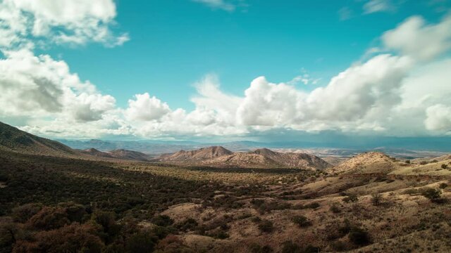 A time-lapse of clouds passing over the borderlands between Nogales, Arizona and Nogales, Mexico as seen from Duquesne Road in the Patagonia Mountains in the Coronado National Forest.