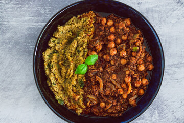 plant-based food, vegan moroccan cous cous with chickpea onion and mushroom stew with plenty of spices and herbs