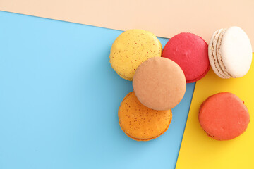 Colorful macarons isolated in pastel background