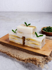 Nagasari loyang or cake pan nagasari, Indonesian traditional steamed snack made from rice flour, coconut milk, banana and served slices.