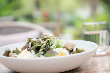 caesar salad appetizer on wooden background