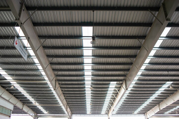 The roof is made of matal sheet  and has a strong structure with translucent panels to provide light