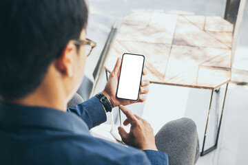 cell phone blank white screen mockup.man hand holding texting using mobile on desk at office.background empty space for advertise.work people contact marketing business,technology