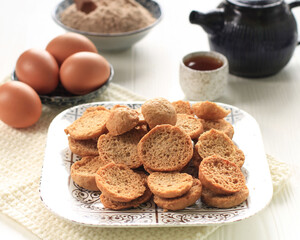 Bagelen Cake, Crispy Bread with Butter Spread and White Sugar Sprinkle. Usually Served with Tea for...