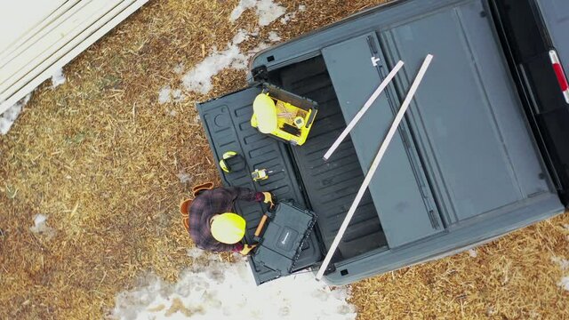 Caucasian Contractor Preparing Himself For Another Day in the Construction Zone.