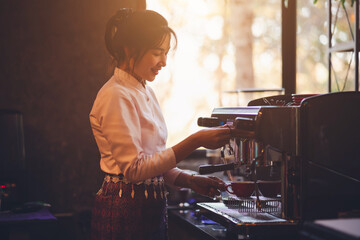 Barista making coffee in coffeeshop