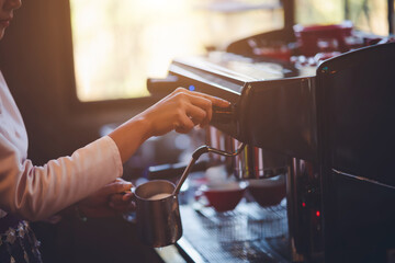Barista making coffee in coffeeshop