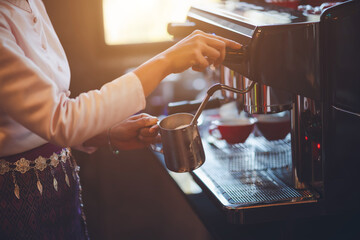 Barista making coffee in coffeeshop