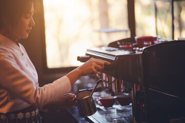 Barista making coffee in coffeeshop