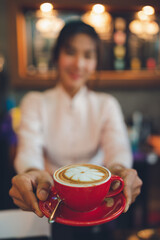 Barista making coffee in coffeeshop