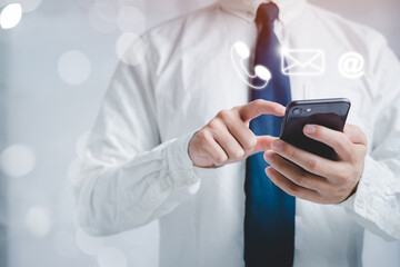 men holding a smartphone To communicate with people through email, phone numbers and the Internet. Concept of smartphones in the future. Long Distance Communications LoT.