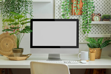 Biophilia workspace in home office room with computer, supplies and plants house