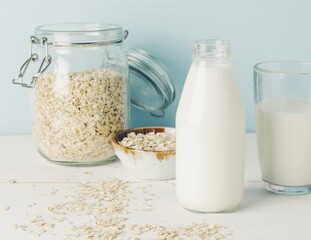Vegan oat milk, non dairy alternative milk in a glass close up