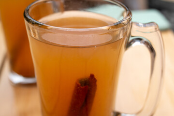 October 2020: An autumn cup of Hot Apple Cider with a cinnamon stick garnish in downtown Toronto, Canada — the perfect fall beverage for keeping warm.