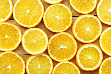 Fototapeta premium Orange slices texture background, Fresh orange fruits orange pattern on wooden background