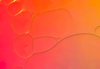 Abstract background with orange colors. Oil droplets in water abstract psychedelic pattern image.
