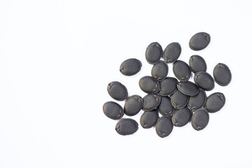 Black seeds, Dried gourd luffa seed on white background