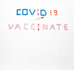 Pills spelling and emphasizing the Coronavirus Vaccination during Covid 19 with Copy Space