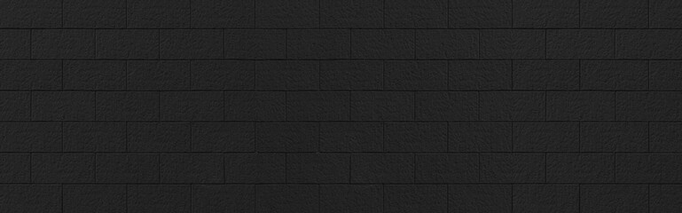 Panorama of Vintage black stone brick wall pattern and background seamless