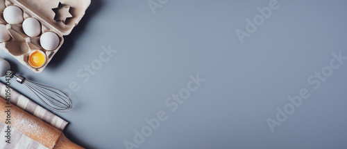 Banner, Flat Lay composition, ingredients for baking cookies on a gray background, copy space. Making cookies or cupcakes for Valentine's Day, Mother's Day, Father's Day. The concept of festive food