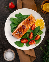 Baked or fried salmon and salad, Paleo, keto, fodmap, dash diet. Mediterranean food with steamed fish. Oven asian dish with teriyaki. Healthy concept, gluten free, lectine free, top view, vertical