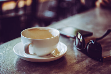 Close up white cup is empty on the table during work breaks.