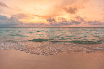 Closeup sea sand beach. Panoramic beach landscape. Inspire tropical beach seascape horizon. Orange and golden sunset sky calmness tranquil relaxing sunlight summer mood. Vacation travel holiday banner