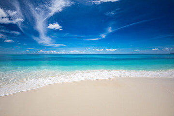 Closeup of sand on beach and blue summer sky. Panoramic beach landscape. Empty tropical beach and seascape. Blue sky, soft sand, calmness, tranquil relaxing sunlight, summer mood. Travel vacation