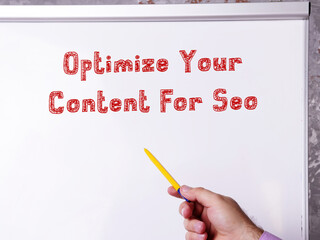 Motivational concept about Optimize Your Content For Seo with sign on the piece of paper.