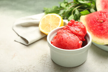 Bowl with watermelon ice cream on light background