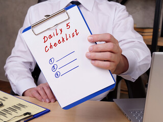  Financial concept meaning Daily 5 Checklist with inscription on the sheet.