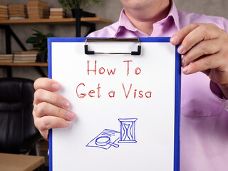 Business concept meaning How To Get a Visa with phrase on the sheet.