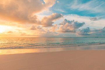 Closeup sea sand beach. Panoramic beach landscape. Inspire tropical beach seascape horizon. Orange and golden sunset sky calmness tranquil relaxing sunlight summer mood. Vacation travel holiday banner - obrazy, fototapety, plakaty