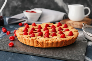 Tasty raspberry pie on dark background