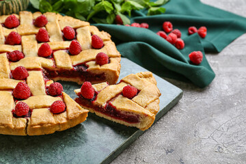 Delicious raspberry pie on dark background, closeup