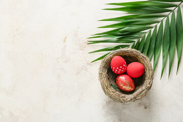 Composition with beautiful Easter eggs on light background