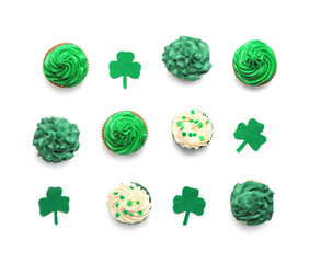 Tasty cupcakes for St. Patrick's Day on white background
