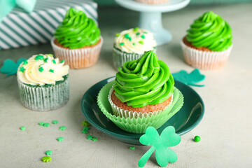 Tasty cupcakes for St. Patrick's Day on table