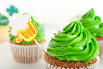 Tasty cupcakes for St. Patrick's Day on white background, closeup