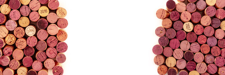 Wine tasting panoramic banner. Many wine corks, shot from the top on a white background with a place for text