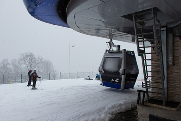 Strong snowfall in Tufandag, Gabala - Azerbaijan. Winter holiday. Skiers and cable car.